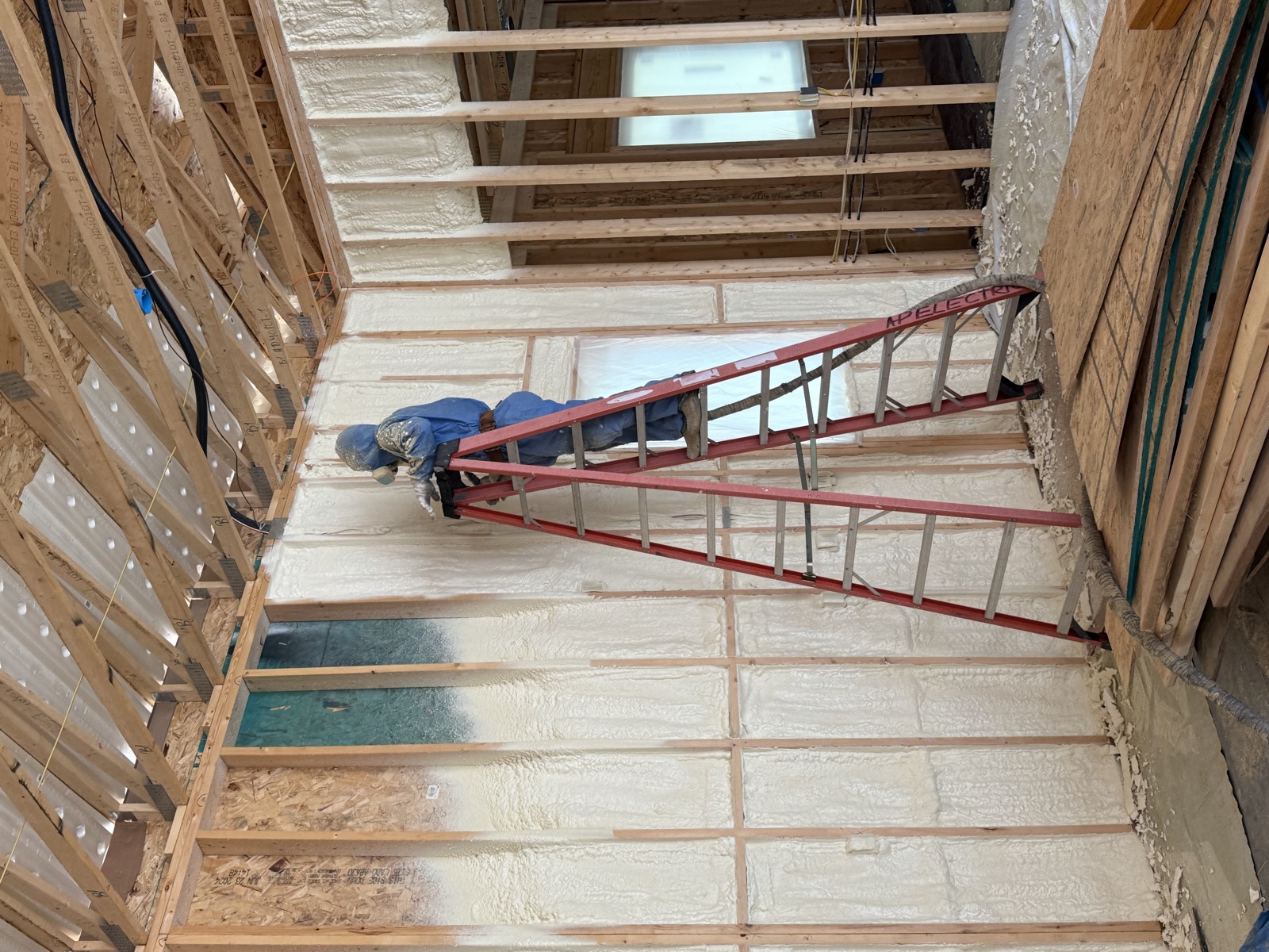 Spray foam insulation applied to framed walls