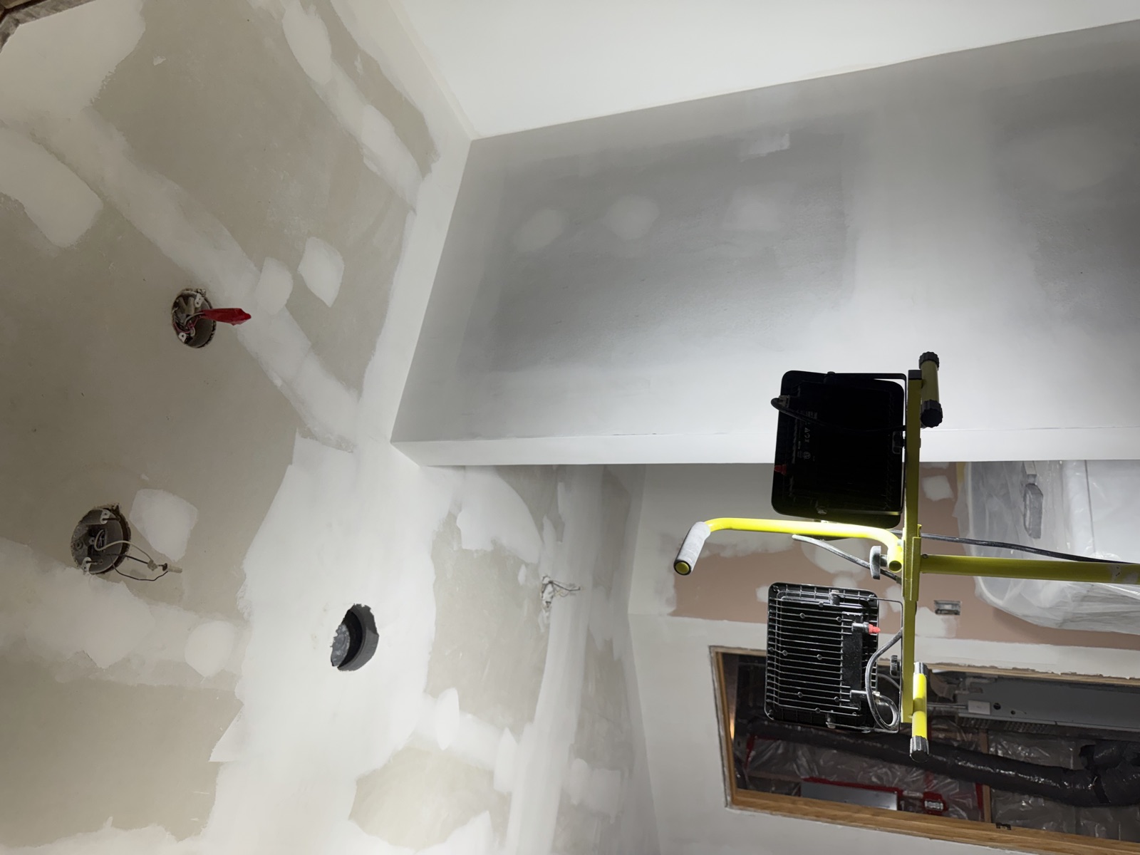 Drywall being taped and finished