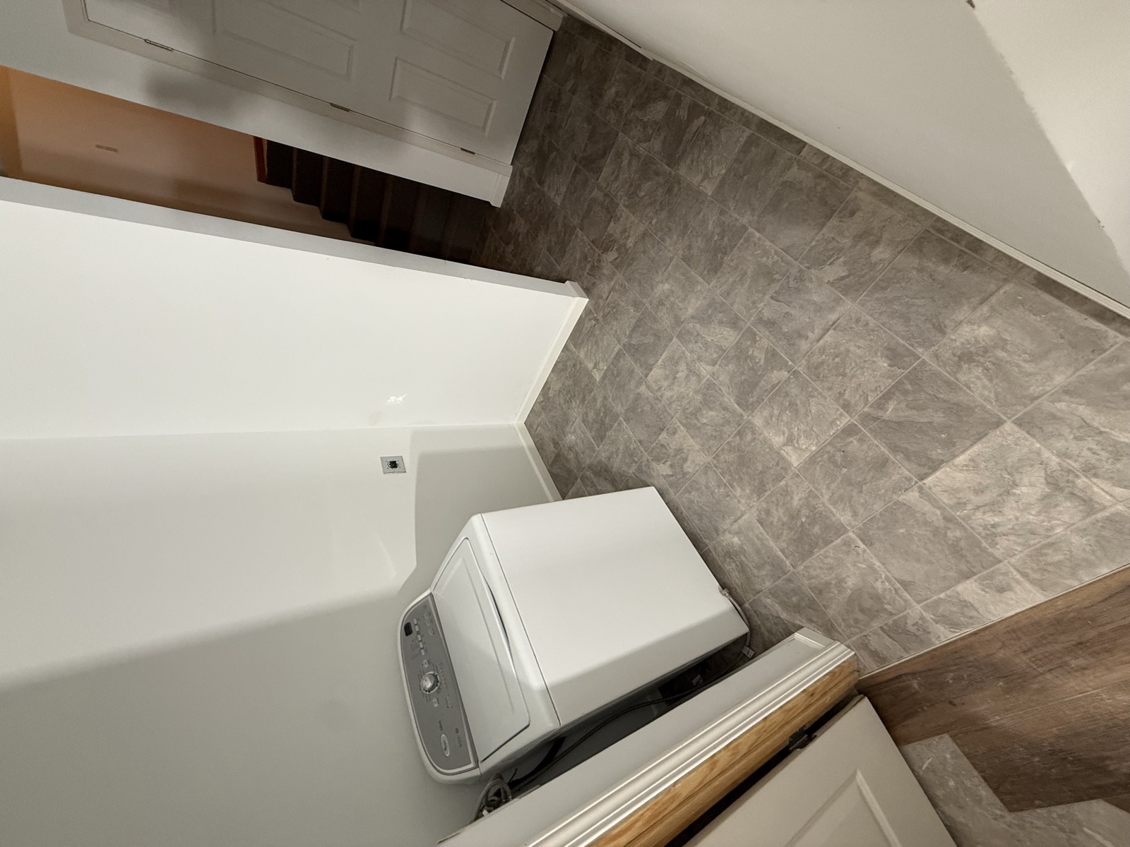 Finished lower-level laundry with new tile floor